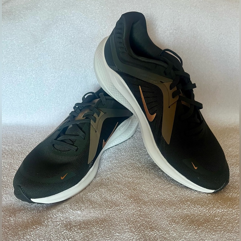 Nike women’s size 10, black, grey and olive color.